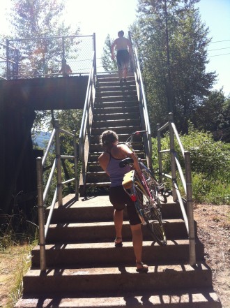People wanting to take the trail into North Bend have to carry their bikes up the stairs, which were set on fire.