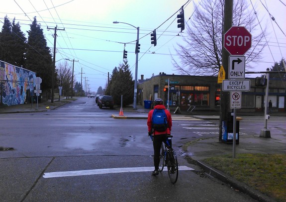 People on bikes can choose to either cross in the street at Beacon Ave S or use the pedestrian signal