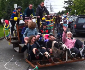 Wait, is that Sally Bagshaw and Tom Rasmussen pedaling a crazy Stevens-designed pedal-powered parade float? Yes. Yes it is.