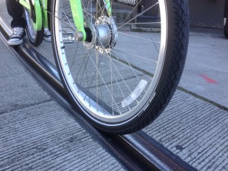Fatter tires (like the ones on Pronto bikes) are less likely to get stuck in streetcar tracks. But tracks can still be dangerously slick when wet.