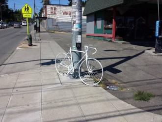 Photo of the ghost bike memorial at NE 65th Street and 15th Ave NE, from ghostbikeguy
