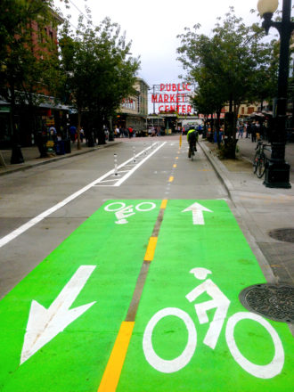 One option that should be on the table: Simply extending this one-block bike lane on Pike through downtown.