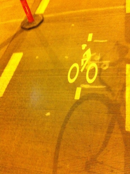 If you see this little dude, line your wheels up with the two white lines and the signal should detect your bike