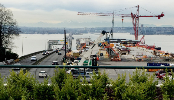 The old 520 Bridge on the left has no space for biking and walking. The new bridge is much wider and will have a trail.