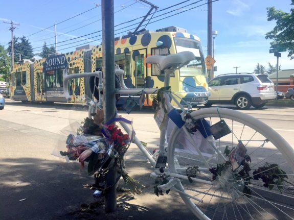 Friends and family of Desiree McCloud painted her bike white and decorated it with notes, flowers and Magic cards. Unlike most ghost bikes, this one is the bike she was riding when she crashed. 