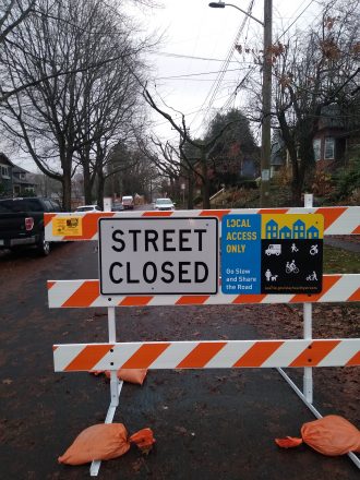 Heavy duty street closed barricade on a Stay Healthy street