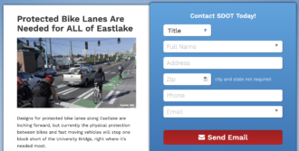 Screenshot of the action alert website. Text: Protected Bike Lanes Are Needed for ALL of Eastlake Green Bike Lane at Eastlake and Fuhrman Avenue East, Seattle, WA | National Association of City Transportation Officials Designs for protected bike lanes along Eastlake are inching forward, but currently the physical protection between bikes and fast moving vehicles will stop one block short of the University Bridge, right where it’s needed most.