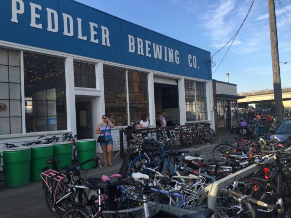 Photo of the front of the business with bikes overflowing everywhere. 