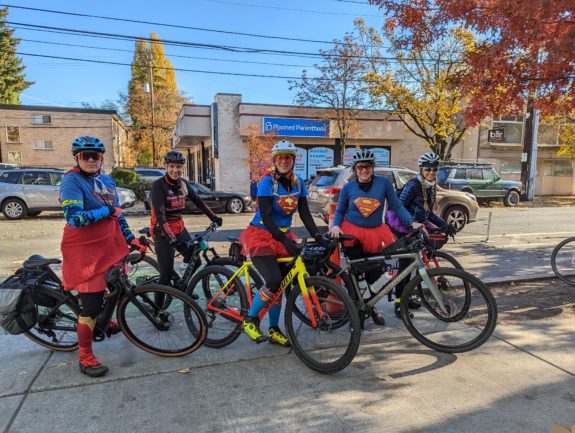 Riders dressed as super heroes
