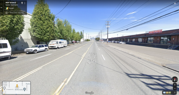 Google Street View image of a wide and empty 1st Avenue S.