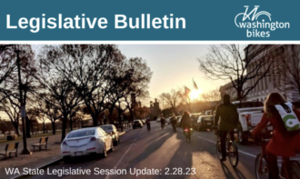 Header of the Washington Bikes Legislative Bulletin with a photo of people biking near the state capitol building.