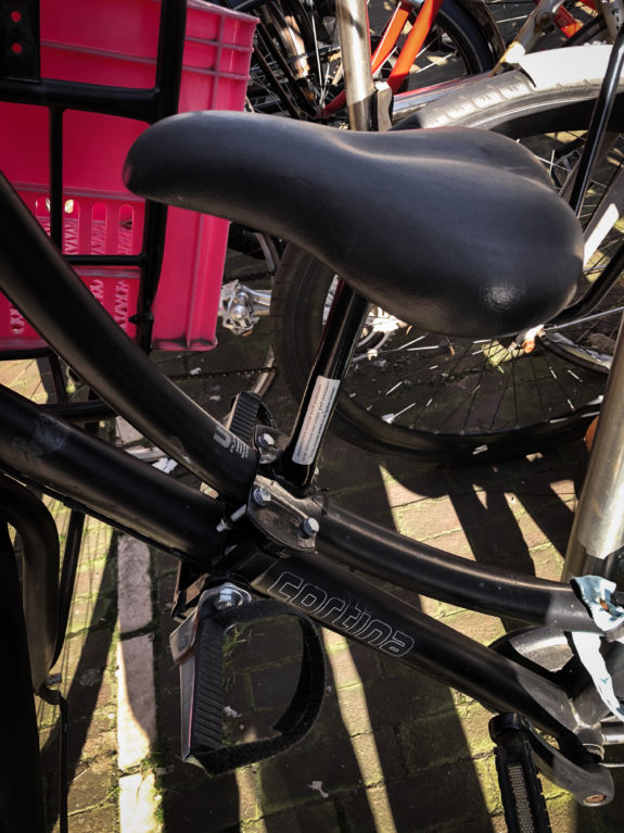 A top tube style bike seat designed for a step-through frame. 