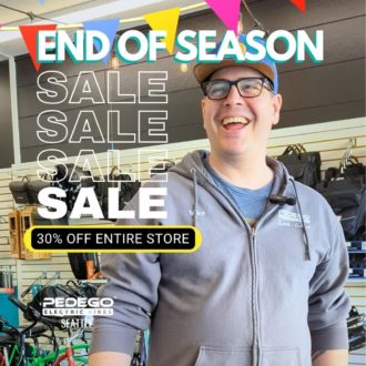 Photo of Mike Nelson in a bike shop with text: End of Season Sale. 30% off entire store.