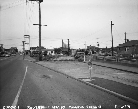Black and white historical photo of two-way traffic on Roosevelt Way as the connection to 11th is under construction.