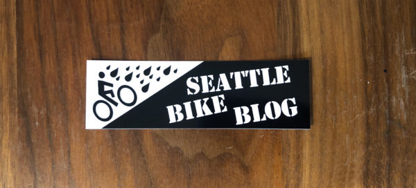 Sticker version of the Seattle Bike Blog header with the biking uphill in the rain logo and Seattle Bike Blog text.